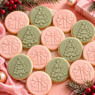 Christmas classroom cookie gift set with individually wrapped sage green Christmas tree cookies and blush pink present cookies by Baked By Danelle